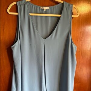 DR2 brand. Dressy tank top in a light blue new condition. Size XL.
